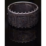 Victorian silver hinged bangle, engraved with birds and foliate detail, having a central scrolled