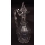 Glass claret jug with conical stopper, faceted body and star cut foot, circa early 19th century,