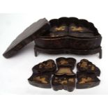 Chinese black and gilt lacquer sewing box of butterfly shape on original fitted stand, the
