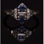 Precious metal Art Deco diamond and sapphire ring, the pierced geometric plaque with a central