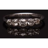 Precious metal five stone diamond ring, a graduated row of five old cut diamonds (approx 0.80ct),