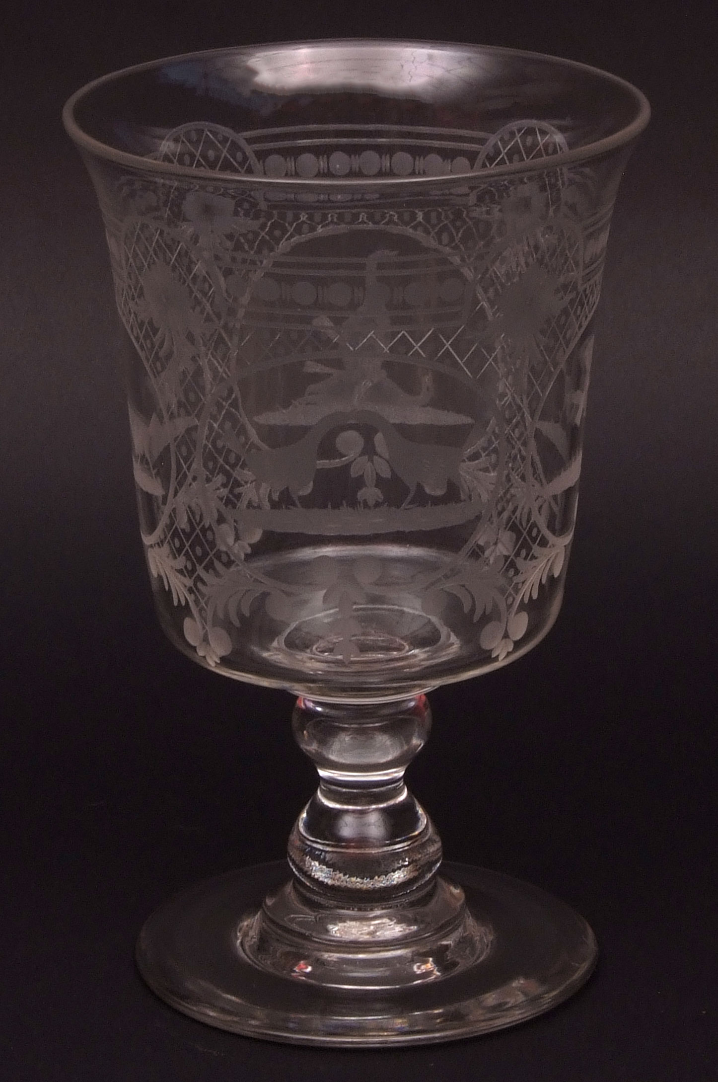 Well engraved large presentation goblet decorated with cockfighting scenes within trellis borders