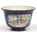Chinese Canton enamelled tea bowl with panels of courtiers set against a vibrant blue diaper ground,