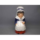 19th century Staffordshire lidded Judy jug modelled as a lady with apron with lid formed as part