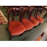 Set of four 19th century mahogany splat back dining chairs with central carved motif with pink