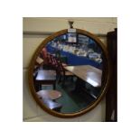 Small gilded oval wall mirror, 17ins diam