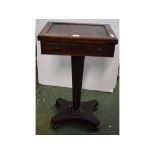 William IV rosewood games table with chequerboard fold-top and faux drawers, on a canted column on a