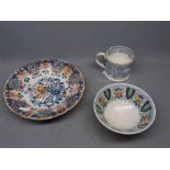 19th century blue and white floral printed mug together with a Quimper ware shallow bowl, painted in