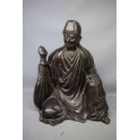 Large cast metal model of a seated Oriental, 14ins high