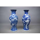 Pair of 19th century Chinese blue and white vases with blossom pattern, fluted necks, bearing four