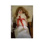 French bisque headed doll with composition body, approx 19ins long