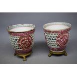 Pair of Chinese double walled tea bowls with open work sides revealing blue and white floral