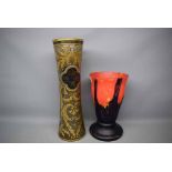 Modern Studio glass volcano vase with black circular glass foot, mottled red and orange top,