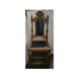 19th century Gothic oak hall chair with leather upholstered seat and back panel, buttoned detail,