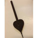 Indian heavily carved heart shaped set of bellows (a/f), 38ins long