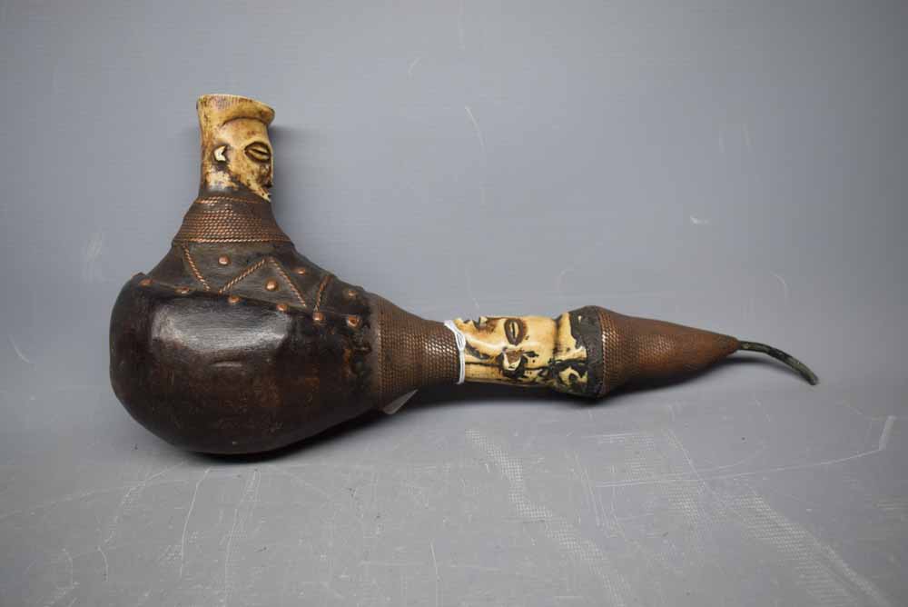 Unusual bone mounted and wood tribal type pipe, 14ins long