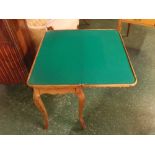 Walnut fold-over card table with chequerboard top, green baize interior on four shaped legs, 30ins x