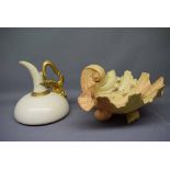 Royal Worcester blush ewer of squat form with a cream body and a gilded gryphon style handle,