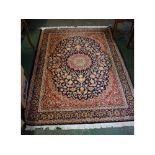 @Modern Keshan carpet with blue ground, central floral lozenge with rust border, 230 x 160