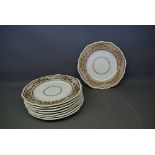 Set of eight 19th century Spode dinner plates with puce border, gilded design, 9ins diam