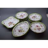 Continental painted dessert set with floral decorated centre, green shaped rim comprising twelve