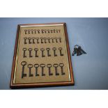 Framed set of approximately 36 vintage keys