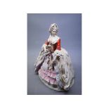 Large late 19th/early 20th century Naples porcelain figurine of a crinoline lady holding flowers