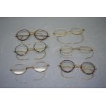 Box containing six pairs of assorted vintage horn-rimmed and gold plated framed spectacles