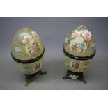 Pair of Continental glass egg formed storage boxes with brass mount and hinged detail, raised on a