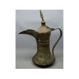 Vintage metal Indian ewer with shaped handle and hinged lid, with poker-work detailing (a/f),