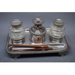 Regency period silver plated ink stand, rectangular shape with gadrooned rim holding two cut glass