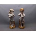 Pair of 19th century German bisque figures of a young girl holding a dove and a young boy holding