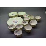 Quantity of Aynsley part tea wares with green and gilded rims, central floral painted panel