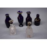 Mixed Lot: four 19th century Bristol blue miniature decanters with gilded detail, two with