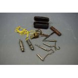 Packet of various vintage items including corkscrew, three whistles, two dog whistles and an antique