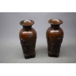 Pair of 20th century Japanese vases, with decorative figure castings to the body of the vase, raised
