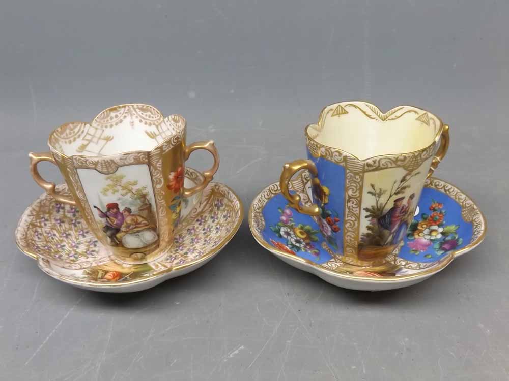 Two 19th century Augustus Rex two-handled cabinet cups and saucers with decorative printed scenes (