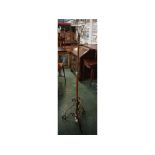 Early 20th century wrought iron and copper adjustable lamp standard on tripod base