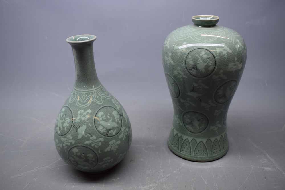 20th century Japanese bulbous vase with green ground, circular panels and a flying Crane, together