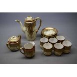 Noritake decorative coffee set with raised gilded relief on a cream body, comprising a coffee pot,