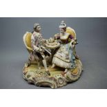 Mid/late 20th century Continental porcelain figure group "Afternoon Tea", 10ins tall (a/f)