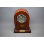 Mahogany framed arch top 8-day mantel clock with silvered dial and inlaid detail with presentation