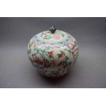 20th century famille verte decorated lidded urn of bulbous form with a floral decoration and a