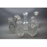 Six 19th/20th century clear cut glass decanters to include two square formed decanters with matching