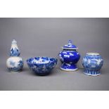 Group of four Chinese blue and white wares to include a lidded squat vase with four character mark