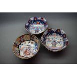 Pair of 20th century Oriental bowls with shaped border and central painted decoration of a vase of