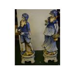 Pair of extremely large Capo di Monte figures of a young boy with a mandolin, together with a