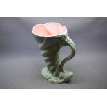 Green glazed Clarice Cliff jug in the form of a shell with twisted decoration and foliate base,