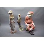 Two Lladro figures, one modelled as a young lady with a cup of tea, and another of a young gent in