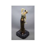 Late 20th century polychrome resin figurine of an Egyptian dancer, unmarked, 15 1/2 ins tall